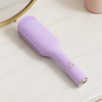 Lilac Purple Pressed Tresses Hair Crimper laying on the vanity ready to be plugged in and make beautiful waves